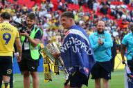 18th May 2024; Wembley Stadium, London, England; EFL League One Play Off Football Final, Bolton Wanderers versus Oxford United; Cameron Brannagan of Oxford United celebrates with the Sky Bet League One Play-off winner trophy