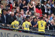18th May 2024; Wembley Stadium, London, England; EFL League One Play Off Football Final, Bolton Wanderers versus Oxford United; Owen Dale, Elliott Moore and Billy Bodin of Oxford United are congratulated by the club co-owners Horst Geicke, Zaki Nuseibeh, Sumrith Thanakarnjanasuth, and Erick Thohir
