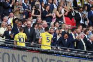 18th May 2024; Wembley Stadium, London, England; EFL League One Play Off Football Final, Bolton Wanderers versus Oxford United; Elliott Moore and Billy Bodin of Oxford United are congratulated by the club co-owners Horst Geicke, Zaki Nuseibeh, Sumrith Thanakarnjanasuth, and Erick Thohir