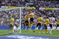 18th May 2024; Wembley Stadium, London, England; EFL League One Play Off Football Final, Bolton Wanderers versus Oxford United; Elliott Moore of Oxford United receives a knock to the head while jumping for a header requiring treatment as a result