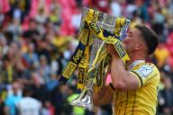 18th May 2024; Wembley Stadium, London, England; EFL League One Play Off Football Final, Bolton Wanderers versus Oxford United; Cameron Brannagan of Oxford United celebrates with the Sky Bet League One Play-off winner trophy