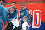 19th May 2024; Selhurst Park, Selhurst, London, England; Premier League Football, Crystal Palace versus Aston Villa; John McGinn of Aston Villa holding a shirt out to be autographed by his teammates for a young fan