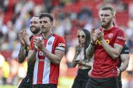 19th May 2024; Bramall Lane, Sheffield, England; Premier League Football, Sheffield United versus Tottenham Hotspur; Oli McBurnie and Jack Robinson of Sheffield applaud the home fans after the final