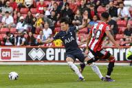 19th May 2024; Bramall Lane, Sheffield, England; Premier League Football, Sheffield United versus Tottenham Hotspur; Son Heung-min of Spurs evades the challenge of Mason Holgte of