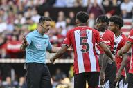 19th May 2024; Bramall Lane, Sheffield, England; Premier League Football, Sheffield United versus Tottenham Hotspur; Referee Andy Madley rescinds the red card issued to Andre Brooks of Sheffield after a VAR