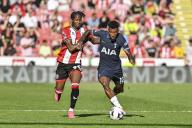 19th May 2024; Bramall Lane, Sheffield, England; Premier League Football, Sheffield United versus Tottenham Hotspur; Andre Brooks of Sheffield challenges Emerson Royal of