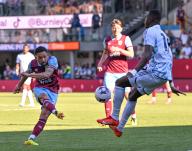 19th May 2024; Turf Moor, Burnley, Lancashire, England; Premier League Football, Burnley versus Nottingham Forest; Vitinho of Burnley shoots at goal but the shot is deflected by Moussa Niakhate of Nottingham