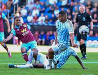 19th May 2024; Turf Moor, Burnley, Lancashire, England; Premier League Football, Burnley versus Nottingham Forest; Wilson Odobert of Burnley shoots at goal but the ball goes wide thanks to the pressure from Murillo of Nottingham