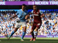 19th May 2024; Etihad Stadium, Manchester, England; Premier League Football, Manchester City versus West Ham United; Rodri of Manchester City takes on Tomas Soucek of West Ham