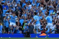 19th May 2024; Etihad Stadium, Manchester, England; Premier League Football, Manchester City versus West Ham United; Rodri of Manchester City celebrates with team mate Phil Foden of Manchester City after scoring for 3-1 after 59