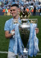 19th May 2024; Etihad Stadium, Manchester, England; Premier League Football, Manchester City versus West Ham United; Phil Foden of Manchester City poses with thewith the Premier League trophy