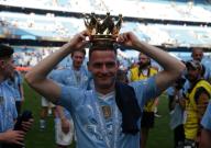 19th May 2024; Etihad Stadium, Manchester, England; Premier League Football, Manchester City versus West Ham United; Sergio Gomez of Manchester City poses with the crown of the Premier League trophy on his head