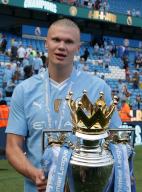 19th May 2024; Etihad Stadium, Manchester, England; Premier League Football, Manchester City versus West Ham United; Erling Haaland of Manchester City with the Premier League trophy during the lap of honour