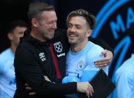 19th May 2024; Etihad Stadium, Manchester, England; Premier League Football, Manchester City versus West Ham United; West Ham first team coach hugs Jack Grealish of Manchester City