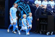 19th May 2024; Etihad Stadium, Manchester, England; Premier League Football, Manchester City versus West Ham United; Kevin de Bruyne of Manchester City walks from the tunnel with mascots before the kick off