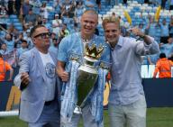 19th May 2024; Etihad Stadium, Manchester, England; Premier League Football, Manchester City versus West Ham United; Erling Haaland of Manchester City and friends pose with the Premier League trophy during the lap of honour