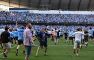 19th May 2024; Etihad Stadium, Manchester, England; Premier League Football, Manchester City versus West Ham United; jubilant Manchester City fans invade the pitch at the final