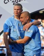 19th May 2024; Etihad Stadium, Manchester, England; Premier League Football, Manchester City versus West Ham United; Manchester City manager Pep Guardiola hugs Erling Haaland during the medal
