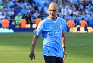 19th May 2024; Etihad Stadium, Manchester, England; Premier League Football, Manchester City versus West Ham United; Manchester City manager Pep Guardiola walks out on the pitch for the medal and trophy