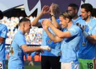 19th May 2024; Etihad Stadium, Manchester, England; Premier League Football, Manchester City versus West Ham United; Phil Foden of Manchester City celebrates with Manchester City manager Pep Guardiola and Jack Grealish during the medal presentation