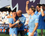 19th May 2024; Etihad Stadium, Manchester, England; Premier League Football, Manchester City versus West Ham United; Manchester City manager Pep Guardiola with Phil Foden and Jack Grealish during the medal presentation