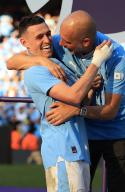 19th May 2024; Etihad Stadium, Manchester, England; Premier League Football, Manchester City versus West Ham United; Manchester City manager Pep Guardiola with Phil Foden during the medal presentation