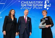 King Philippe - Filip of Belgium hands out the award to winner American chemist Carolyn Bertozzi next to Solvay CEO Ilham Kadri (L) at the award ceremony for the biannual 