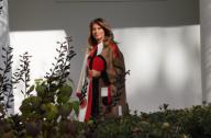 Washington, DC 11/20/18 Melania Trump wearing Christian Dior coat from the pre-fall 2018 collection walks down the White House colonnade to participate in the Thanksgiving event . Photo by Dennis