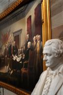 A statue of Alexander Hamilton and the Painting by John Trumbull of the signing of the Declaration of Independence in the Rotunda of the United States Capitol. Photo by Dennis