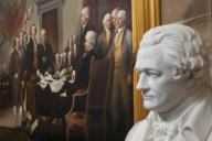 A statue of Alexander Hamilton and the Painting by John Trumbull of the signing of the Declaration of Independence in the Rotunda of the United States Capitol. Photo by Dennis