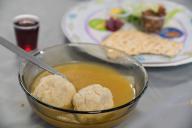 Matzah balls, Ashkenazi Jewish soup dumpling made from a mixture of matzah meal, eggs, water and chicken fat served on Passover Jewish Holiday.Food background and texture
