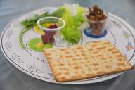 Traditional Seder plate on Passover Jewish Holiday, with six items which have significance to the retelling of the story of Passover - the exodus from Egypt, which is the focus of this ritual meal