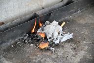 Burning Chametz (foods with leavening agents) and and wooden spoon on the morning before Passover Jewish holiday. Chametz food are forbidden to Jews on the holiday of Passover