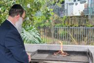 BRISBANE - APR 18 2024:Rabbi Bi\'ur chametz Burning Chametz foods with leavening agents) on the morning before Passover Jewish holiday. Chametz food are forbidden to Jews on the holiday of Passover