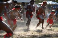 LAURA,QLD - JULY 08 2023:Indigenous Australians men on ceremonial dance in Laura Quinkan Dance Festival Cape York Australia. Ceremonies combine dance, song, rituals, body decorations and