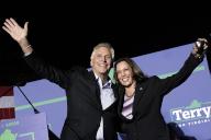 United States Vice President Kamala Harris, right, and Terry McAuliffe, the Democratic Party nominee for Governor of Virginia, left, wave to the crowd at his campaign event in Dumfries, Virginia on Thursday, October 21, 2021. Credit: Yuri Gripas / Pool via