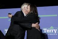 United States Vice President Kamala Harris, right, hugs Terry McAuliffe, the Democratic Party nominee for Governor of Virginia, left, at his campaign event in Dumfries, Virginia on Thursday, October 21, 2021. Credit: Yuri Gripas / Pool via