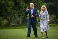 United States President Joe Biden and First Lady Jill Biden walk on the South Lawn of the White House after arriving on Marine One in Washington, D.C., US, on Monday, Aug. 8, 2022. Biden resumed official travel today for the first time since his bout with Covid-19, traveling to Kentucky to show federal support for the state