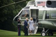 United States President Joe Biden helps First Lady Jill Biden off Marine One on the South Lawn of the White House in Washington, D.C., US, on Monday, Aug. 8, 2022. Biden resumed official travel today for the first time since his bout with Covid-19, traveling to Kentucky to show federal support for the state