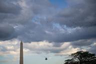 Marine One, with United States President Joe Biden aboard, flies past the Washington Monument prior to landing on the South Lawn of the White House in Washington, D.C., US, on Monday, Aug. 8, 2022. Biden resumed official travel today for the first time since his bout with Covid-19, traveling to Kentucky to show federal support for the state