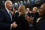 President Joe Biden greets Supreme Court Justice Amy Coney Barrett as Justice Ketanji Brown Jackson applauds as he arrives to give the State of the Union address to a joint session of Congress at the Capitol, Tuesday, March 1, 2023, in Washington. Credit: Jacqueline Martin / Pool via