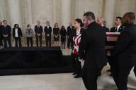 The flag-draped casket of retired Supreme Court Justice Sandra Day OConnor, carried by U.S. Supreme Court Police officers, arrives in the Great Hall at the Supreme Court in Washington, Monday, Dec. 18, 2023. OConnor, a Arizona native and the first woman to serve on the nations highest court, died Dec. 1 at age 93. Watching from left to right: Associate Justices of the Supreme Court Samuel Alito, Sonia Sotomayor, Elena Kagan, Neil M. Gorsuch, Brett Kavanaugh, Amy Coney Barrett, Ketanji Brown Jackson and former Associate Justice of the Supreme Court Anthony M. Kennedy. Justice O