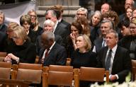 Chief Justice of the United States John G. Roberts, Jr. (R), his wife Jane Sullivan (2nd R), Supreme Court Associate Justice Clarence Thomas (2nd L) and his wife Virginia Thomas (L), attend the memorial service for former Associate Justice of the Supreme Court Sandra Day O
