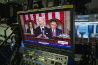 United States President Joe Biden, center, is seen with United States Vice President Kamala Harris, left, and Speaker of the US House of Representatives Mike Johnson (Republican of Louisiana), right, on a television monitor in the James S. Brady Press Briefing Room of the White House, as he delivers his State of the Union address at the US Capitol in Washington, DC, Thursday, March 7, 2024. Credit: Rod Lamkey / Pool via
