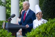 United States President Joe Biden, with White House Chef Cristeta Comerford, delivers remarks during a reception celebrating Asian American, Native Hawaiian, and Pacific Islander Heritage Month in the Rose Garden the White House in Washington, DC, USA, 13 May 2024. Credit: Shawn Thew / Pool via