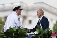 United States President of the Fraternal Order of Police Patrick Yoes shakes hands with President Joe Biden during the National Peace Officers Memorial Service at the U.S. Capitol in Washington, DC on Wednesday, May 15, 2024. Photo by Bonnie Cash/UPI Credit: Bonnie Cash / Pool via
