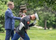 A Marine Guard protects himself against the wind as United States President Joe Biden and first lady Dr. Jill Biden depart Fort Lesley J. McNair in Washington, DC en route to Wilmington, Delaware on Friday, May 24, 2024. Credit: Ron Sachs / Pool via