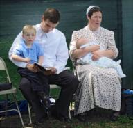 Boston, Massachusetts USA: June 7, 2014 Mennonites rest during an evangelical visit to Boston Common. They and fellow members of the Pennsylvania Mennonite Church sang hymns, passed out brochures, and spoke to passersby. Chris Fitzgerald / Candidate ...