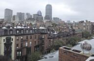 Boston, Massachusetts USA September 29, 2014 The Back Bay neighborhood (in foreground) is seen from a rooftop. Many of the residential buildings are 
