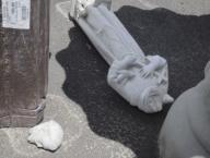 Millis, Massachusetts USA May 20, 2014 A headless statue of Saint Francis of Assisi lays on the ground at a garden center. High winds had knocked over merchandise. Chris Fitzgerald / Candidate